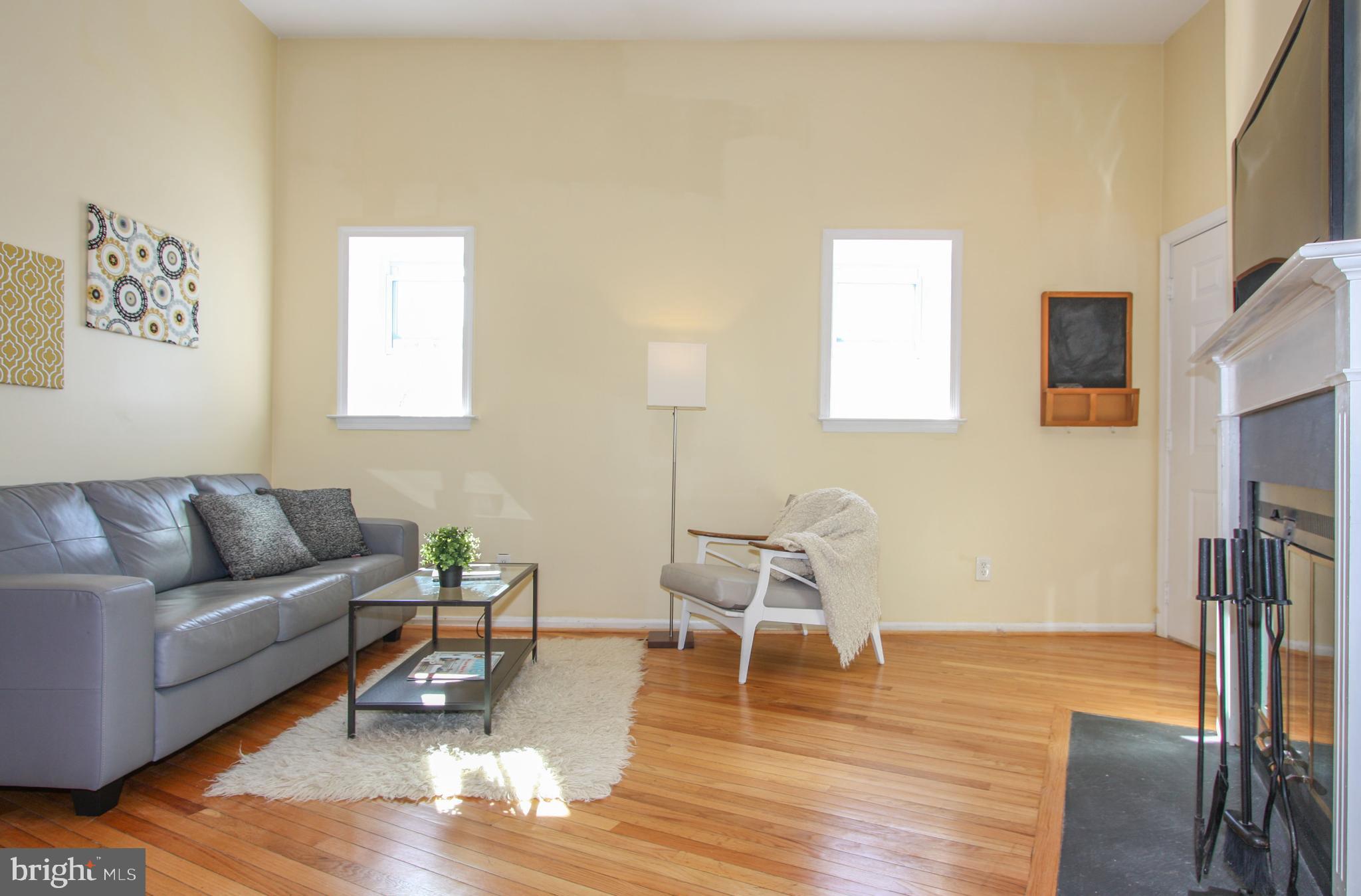 1434 Potomac Avenue Southeast, Unit 5 Washington, DC 20003 - Photo 6 of 38 a living room with furniture and a wooden floor