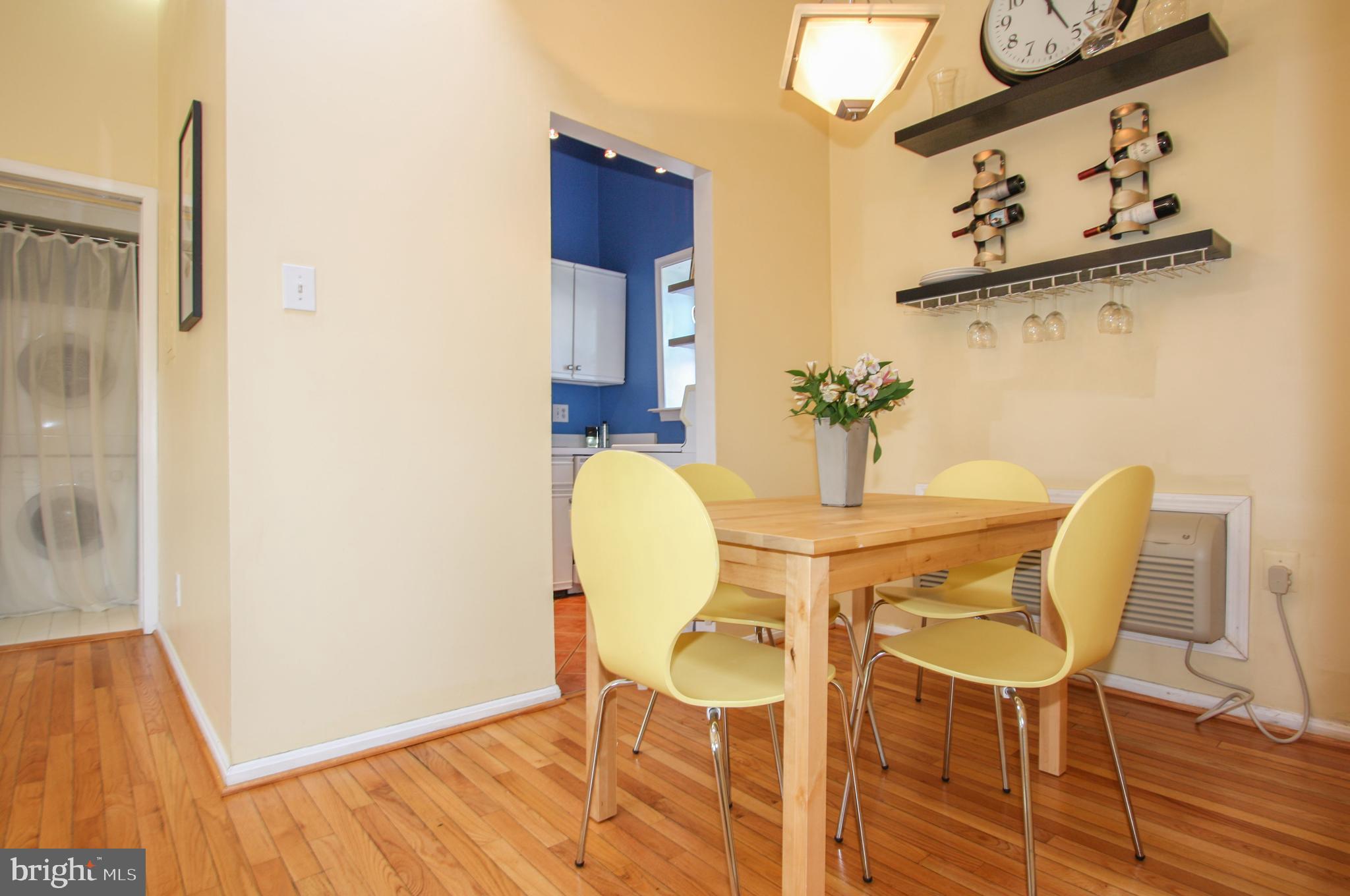 1434 Potomac Avenue Southeast, Unit 5 Washington, DC 20003 - Photo 8 of 38 a dining room with furniture and wooden floor