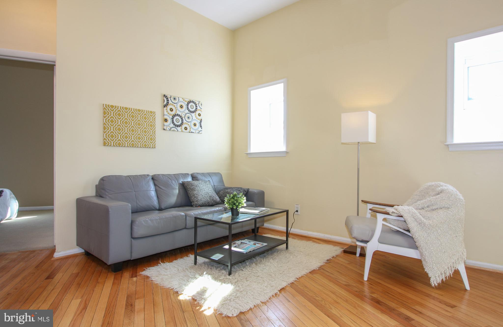 1434 Potomac Avenue Southeast, Unit 5 Washington, DC 20003 - Photo 10 of 38 a living room with furniture and a wooden floor