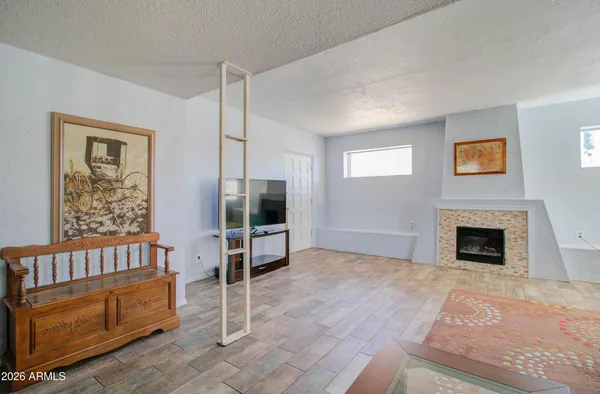 a view of livingroom with furniture and fireplace