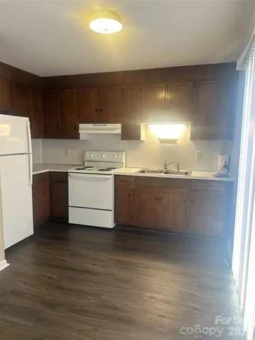 an empty room with wooden floor