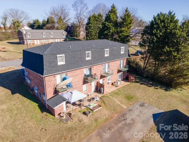 an aerial view of a house with a swimming pool