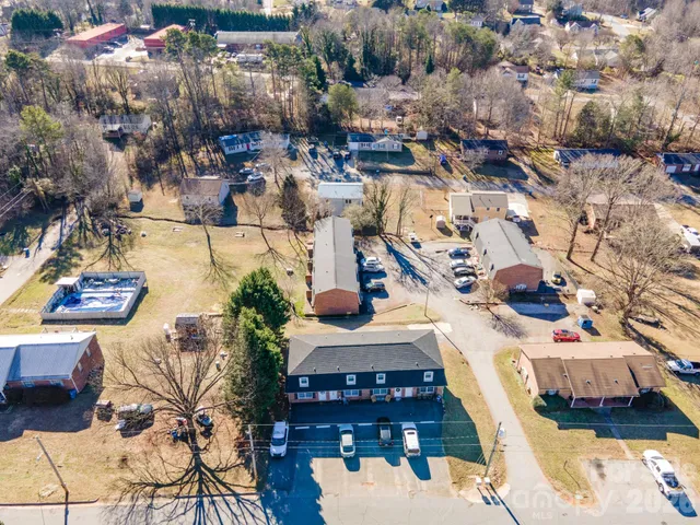 a kitchen with stainless steel appliances a sink a stove a refrigerator and cabinets
