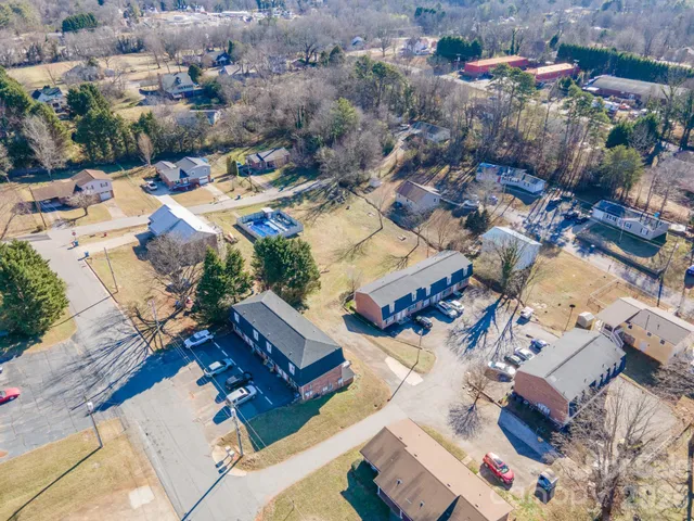 a kitchen with cabinets stainless steel appliances a sink and a window