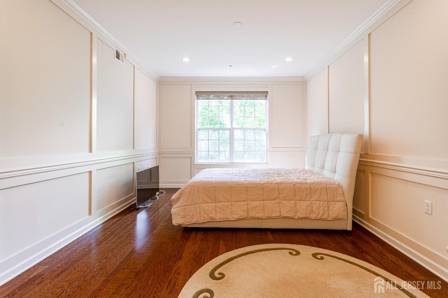 40 Azalea Drive Old Bridge, NJ 08857 - Photo 16 of 35 a bedroom with a bed and a window