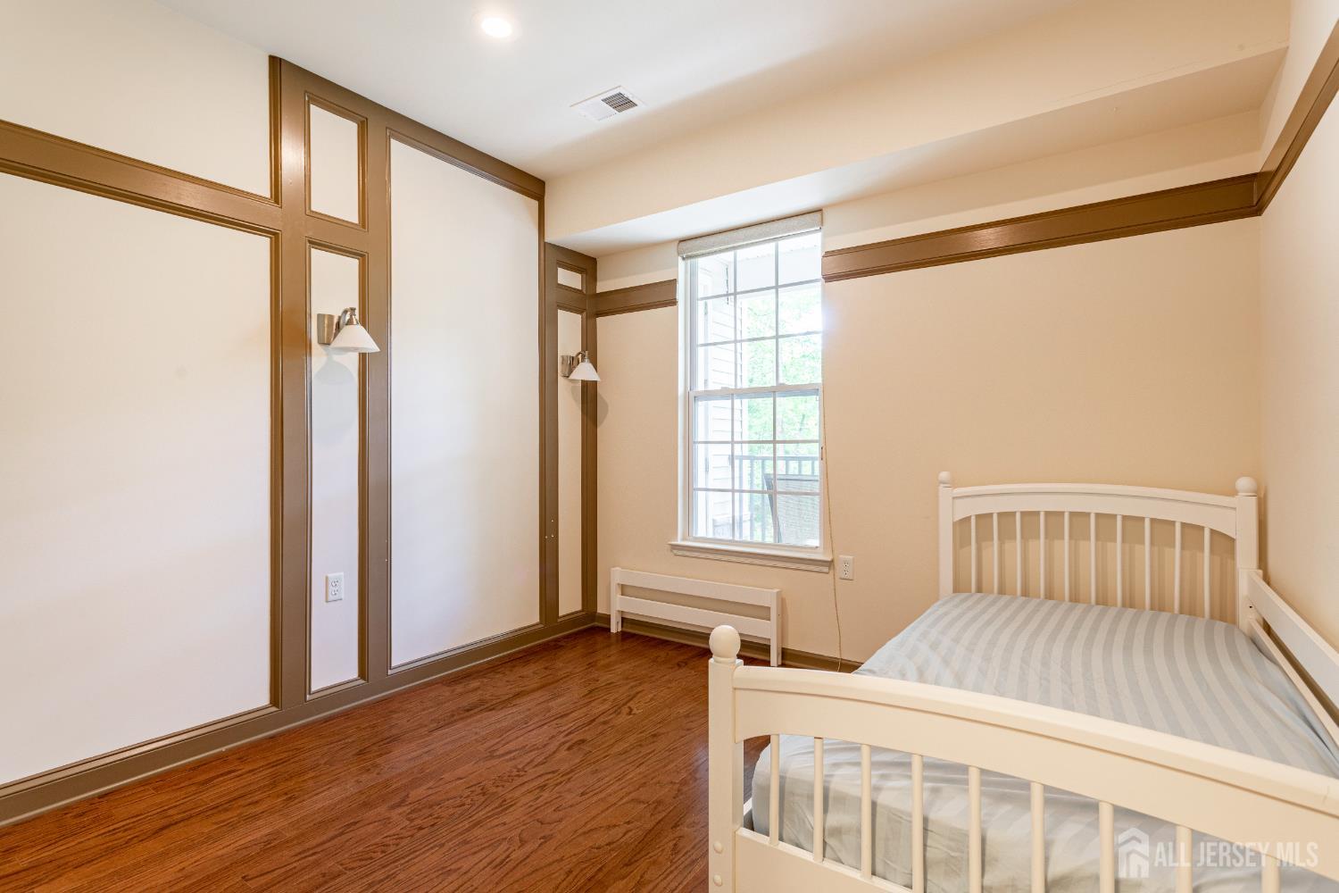 40 Azalea Drive Old Bridge, NJ 08857 - Photo 22 of 35 a bedroom with a bed and a window