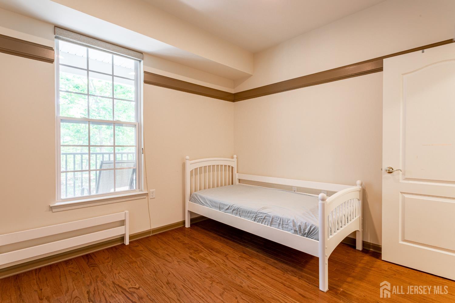 40 Azalea Drive Old Bridge, NJ 08857 - Photo 23 of 35 a room with a bed and a window