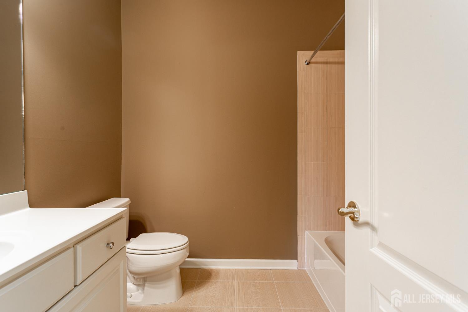 40 Azalea Drive Old Bridge, NJ 08857 - Photo 27 of 35 a bathroom with a toilet and a tub