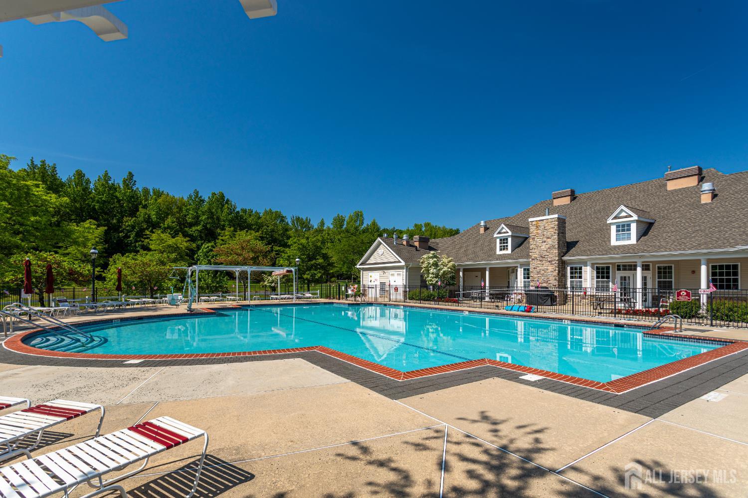 40 Azalea Drive Old Bridge, NJ 08857 - Photo 33 of 35 a view of swimming pool with lawn chairs and large tree