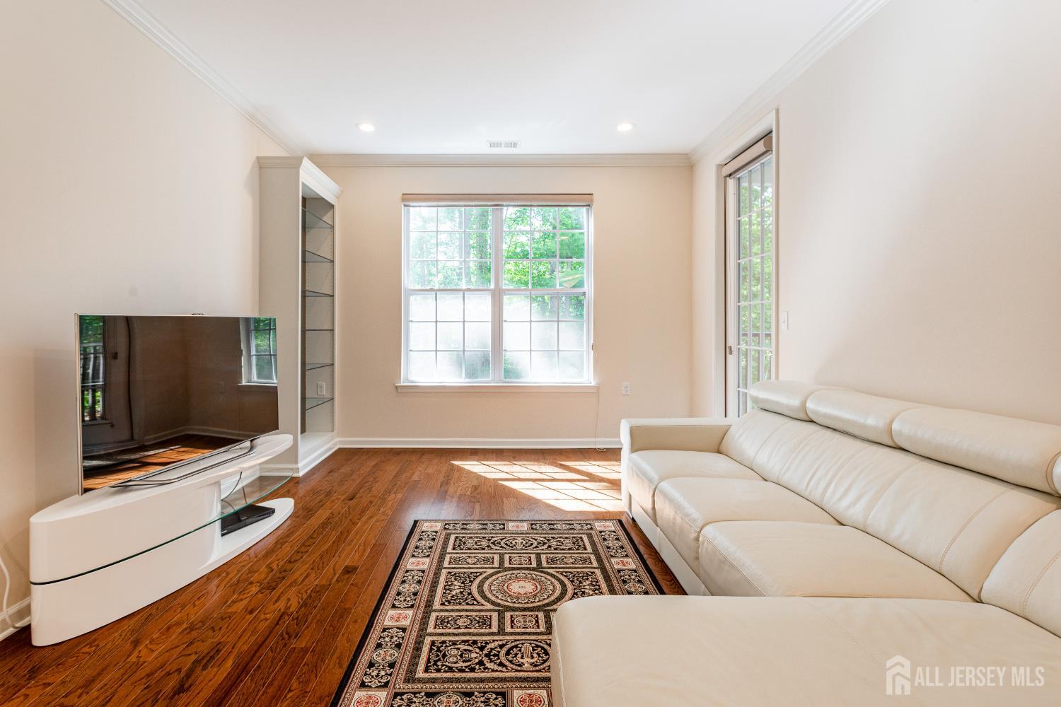40 Azalea Drive Old Bridge, NJ 08857 - Photo 7 of 35 a living room with furniture and a flat screen tv