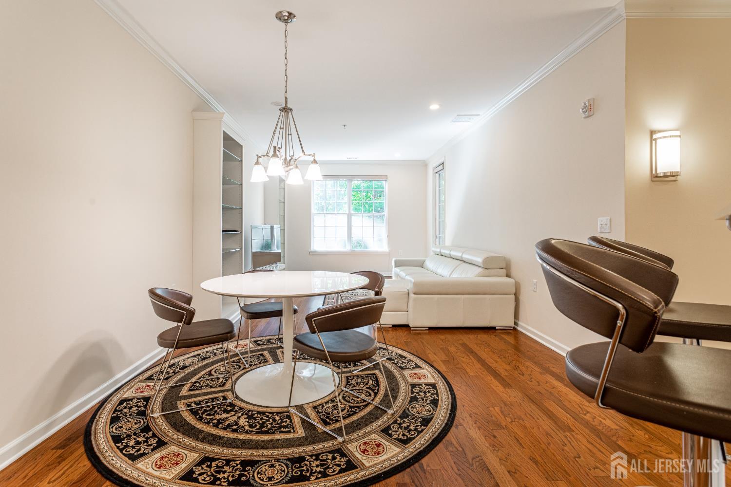 40 Azalea Drive Old Bridge, NJ 08857 - Photo 8 of 35 a room with furniture and a chandelier