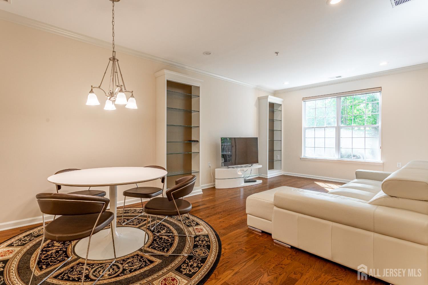 40 Azalea Drive Old Bridge, NJ 08857 - Photo 9 of 35 a living room with furniture a window and a chandelier
