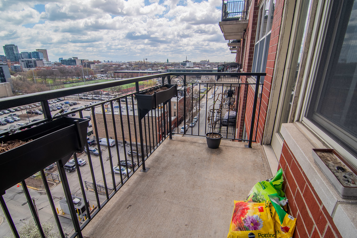 6 South Laflin Street, Unit 808 Chicago, IL 60607 - Photo 11 of 13 a view of a balcony with wooden fence