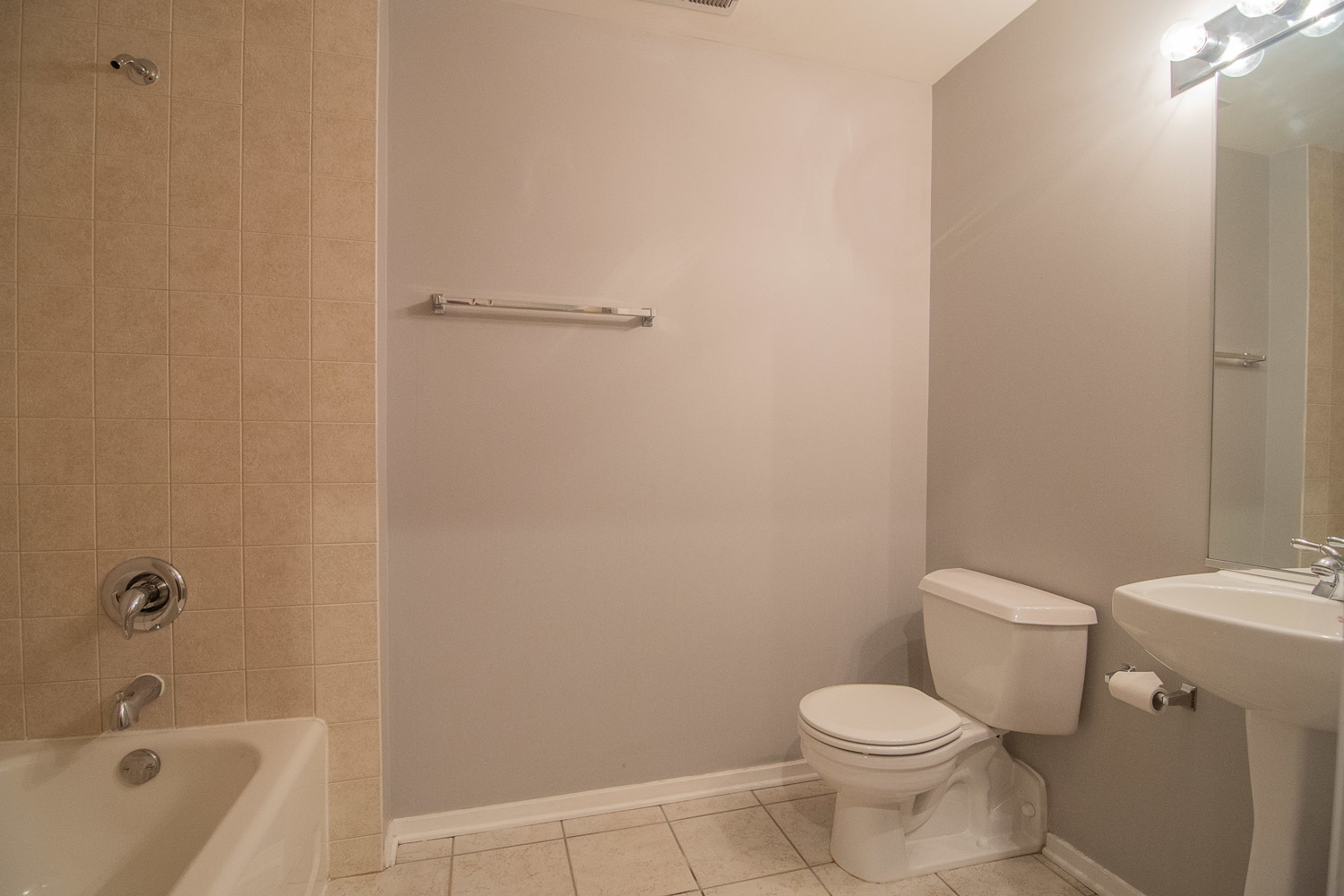6 South Laflin Street, Unit 808 Chicago, IL 60607 - Photo 9 of 13 a white toilet sitting next to a bath tub