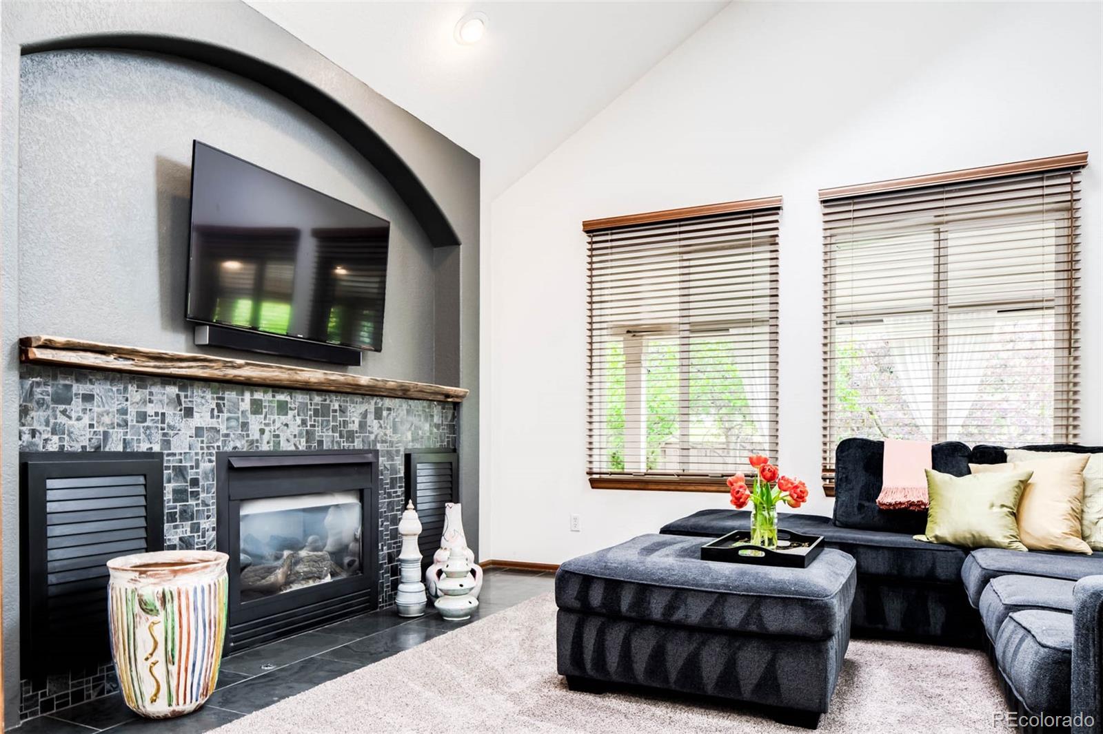6549 Poppy Street Arvada, CO 80007 - Photo 11 of 33 a living room with furniture and a fireplace