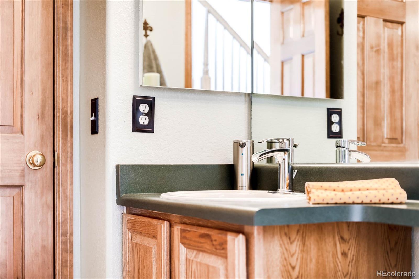 6549 Poppy Street Arvada, CO 80007 - Photo 13 of 33 a kitchen with a sink and a window