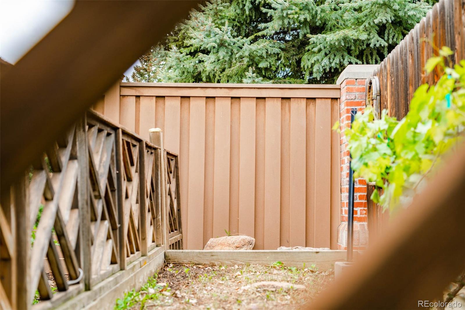 6549 Poppy Street Arvada, CO 80007 - Photo 31 of 33 a view of a wooden fence