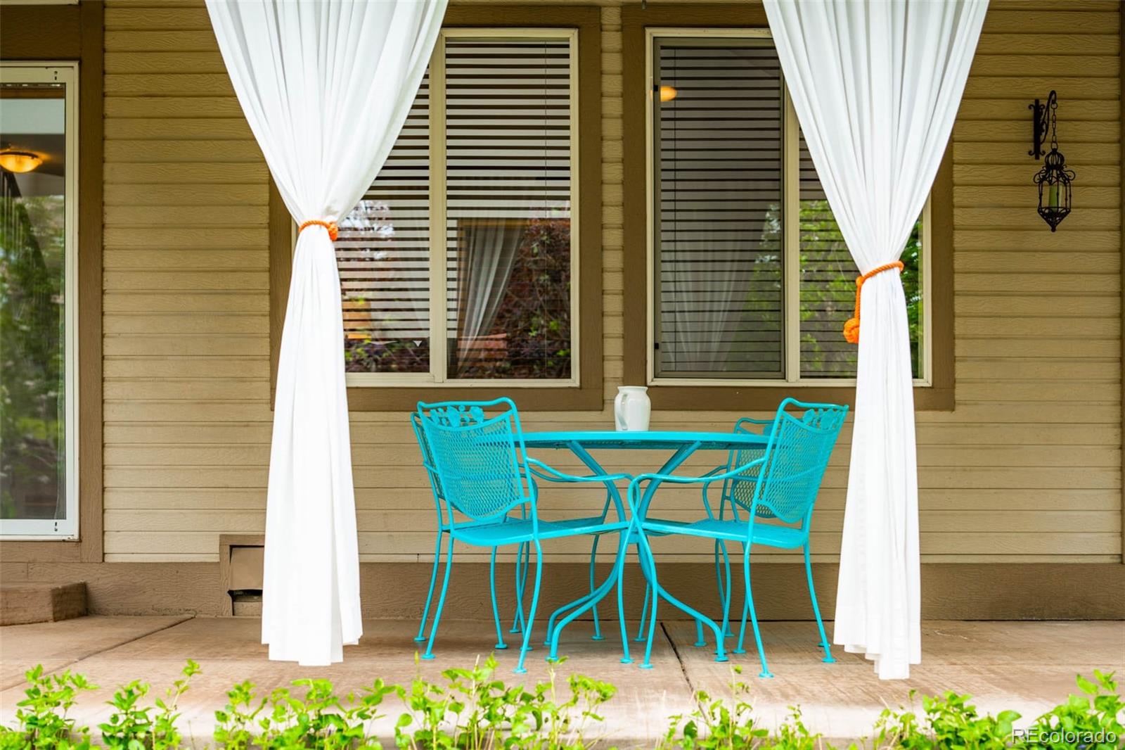 6549 Poppy Street Arvada, CO 80007 - Photo 33 of 33 a front view of a house with balcony