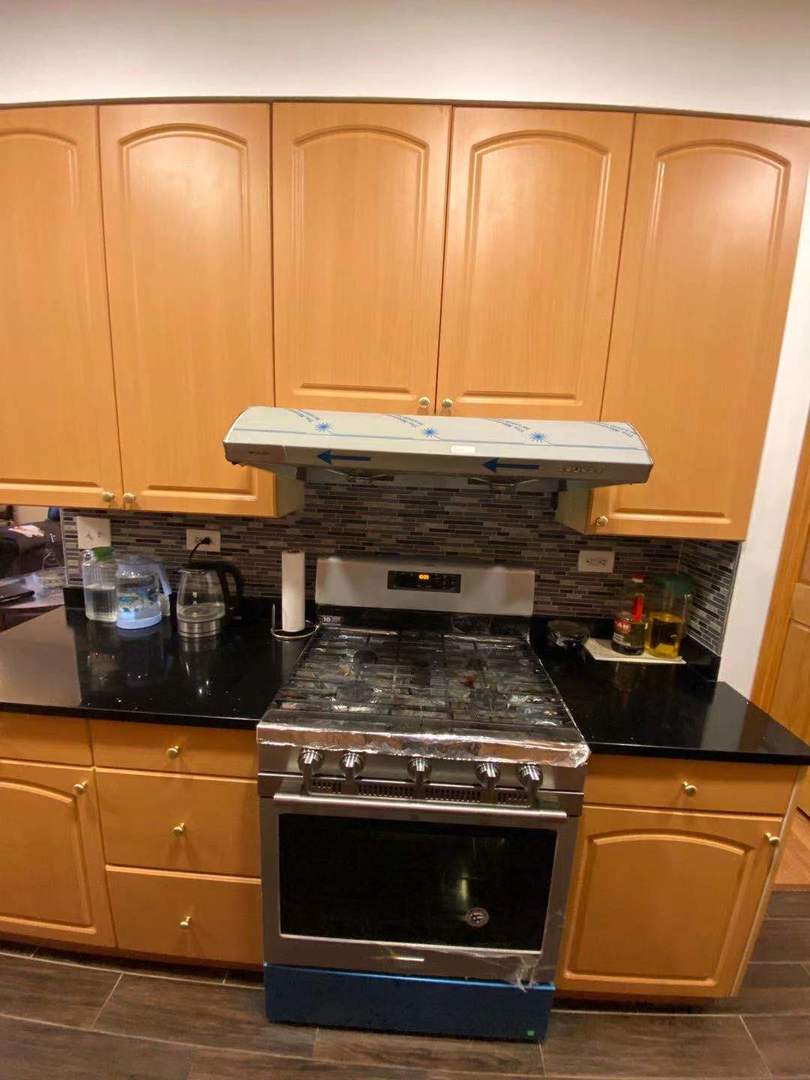 723 West 31st Street, Unit 2 Chicago, IL 60616 - Photo 8 of 21 a stove top oven sitting inside of a kitchen