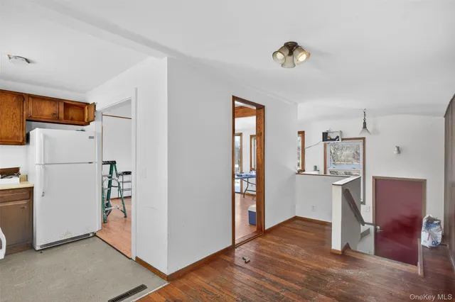 a view of kitchen with furniture and wooden floor