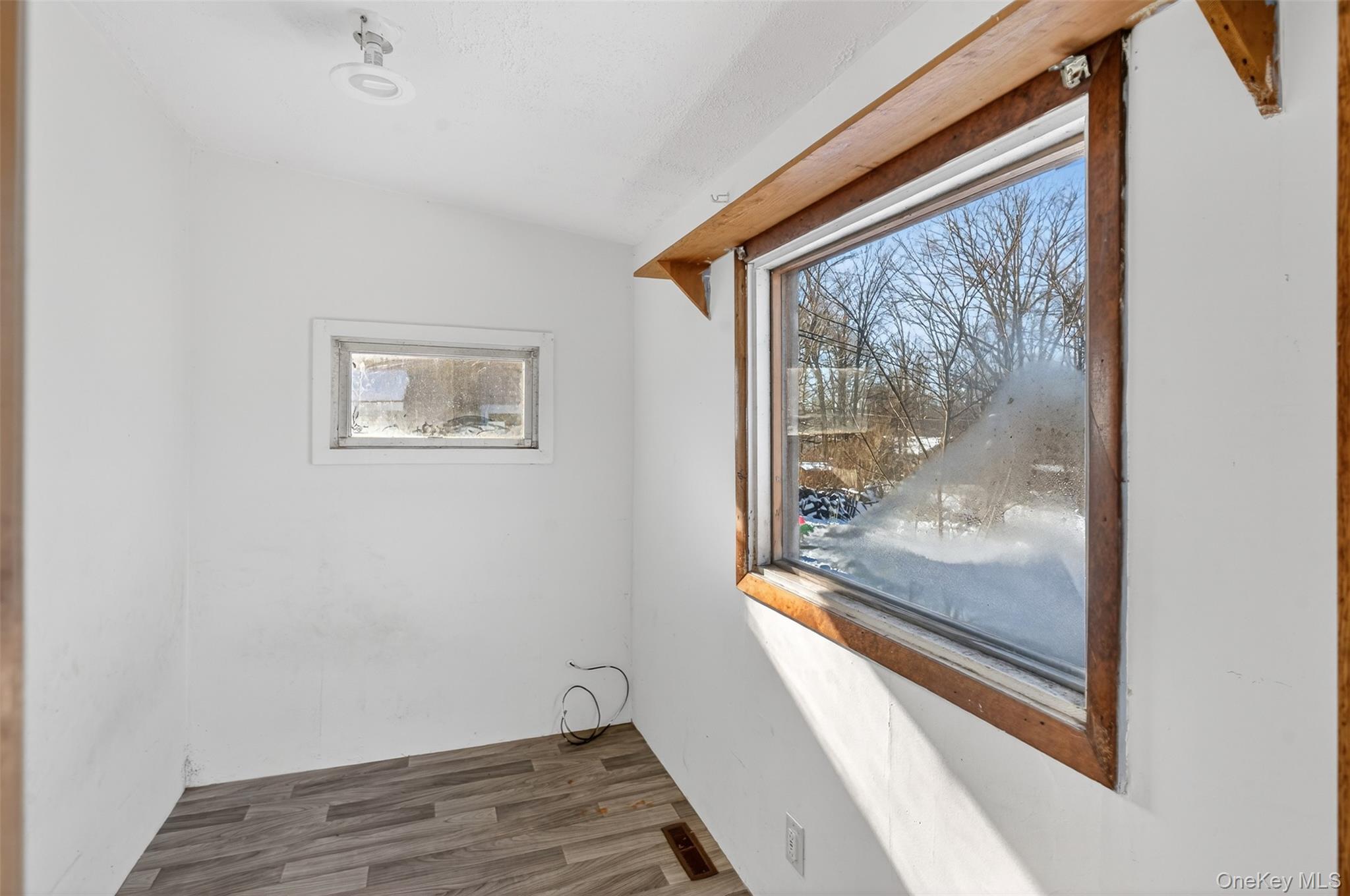 488 Tally Ho Road Middletown, NY 10940 - Photo 16 of 16 a view of a hallway with wooden floor and a floor to ceiling window