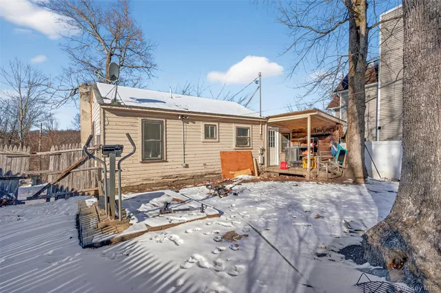 a view of a patio with a table and chairs