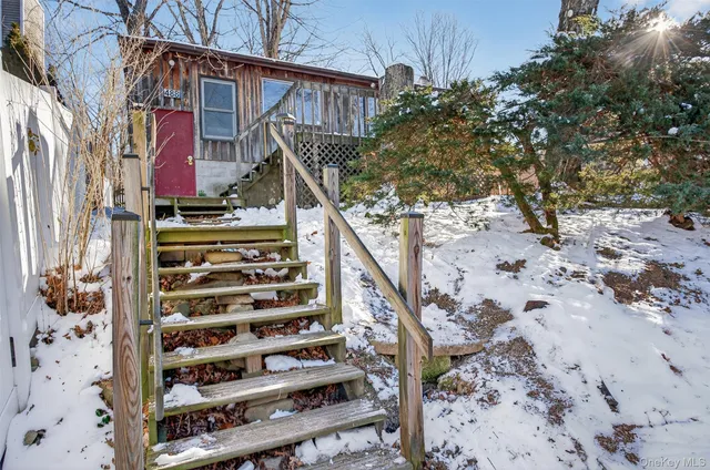 front view of a house with a trees
