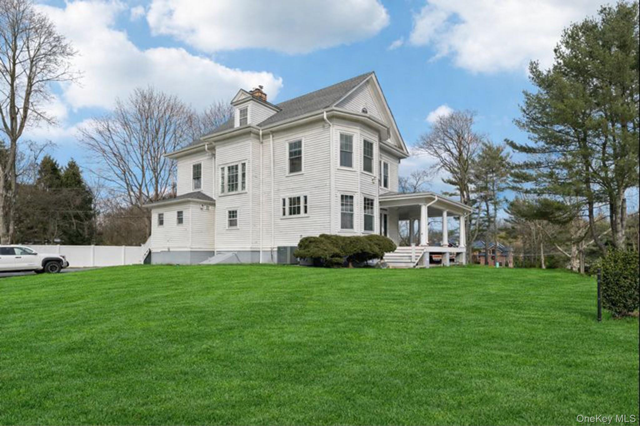 397 Split Rock Road Syosset, NY 11791 - Photo 2 of 29 a view of a house with a yard