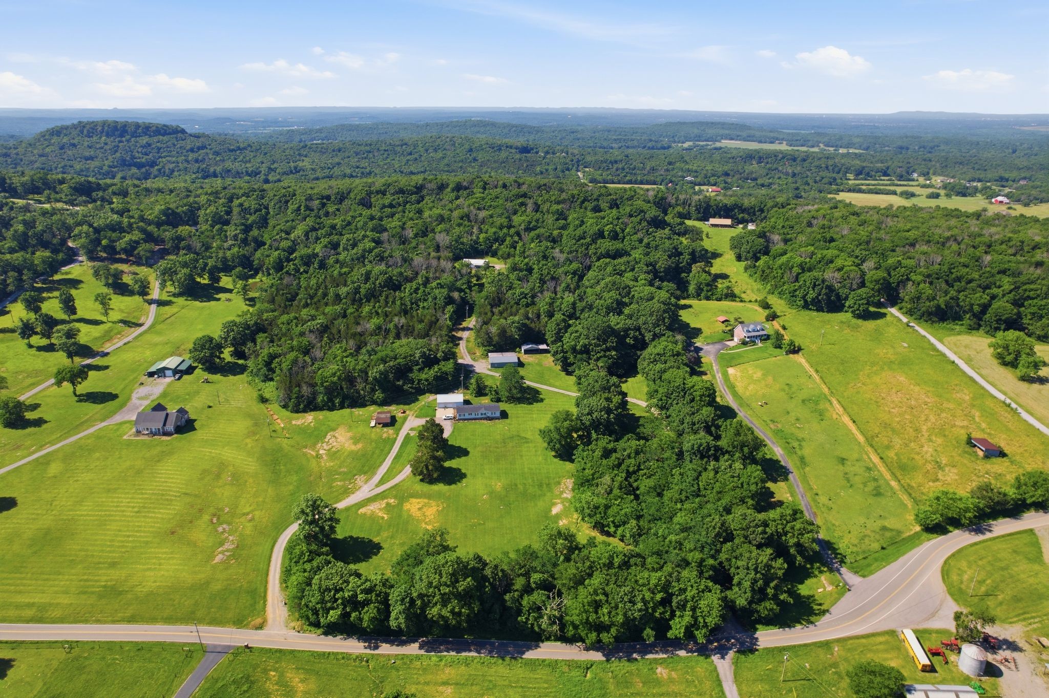 1021 B Jordan Road Lascassas, TN 37085 - Photo 2 of 58 an aerial view of residential houses with outdoor space and city view