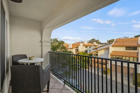 a view of a balcony with furniture