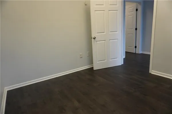 an empty room with wooden floor