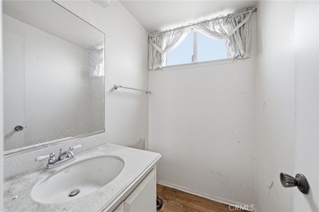 5131 Rotherham Circle Westminster, CA 92683 - Photo 24 of 50 a bathroom with a sink and a mirror