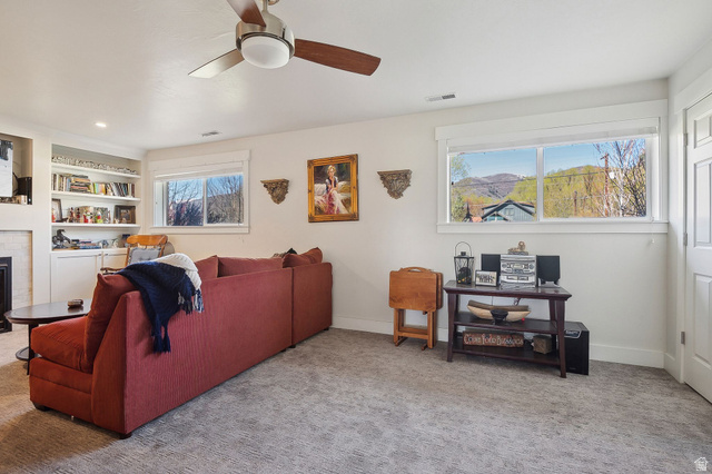 550 Pine Canyon Road Midway, UT 84049 - Photo 25 of 44 Spacious room featuring broad windows with mountain scenery, recessed lighting, and a ceiling fan with wood-finish blades