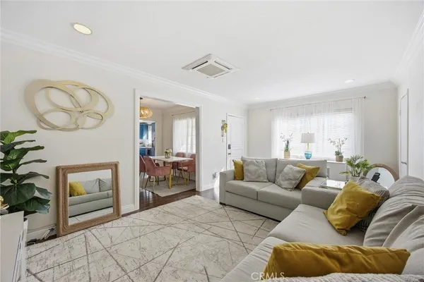 a living room with furniture a fireplace and a table