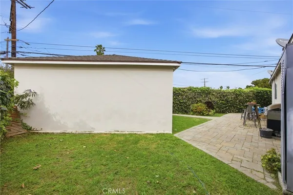 a view of a backyard with potted plants