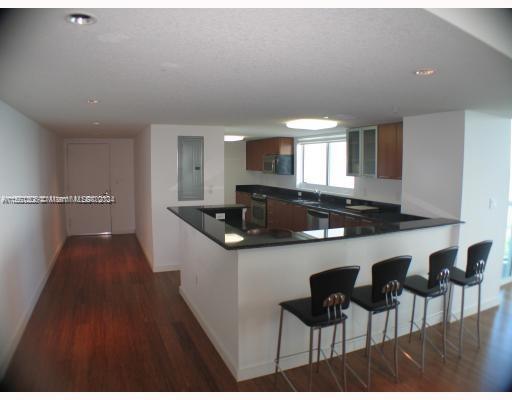 Edgewater Miami, FL 33132 - Photo 3 of 6 a kitchen with a sink cabinets and window