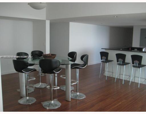 Edgewater Miami, FL 33132 - Photo 5 of 6 a view of entryway and hall with wooden floor