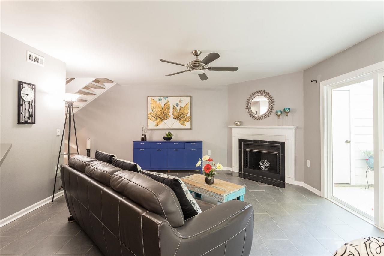 7615 Falcon Rest Circle, Unit 7615 Raleigh, NC 27615 - Photo 12 of 26 a living room with furniture and a fireplace
