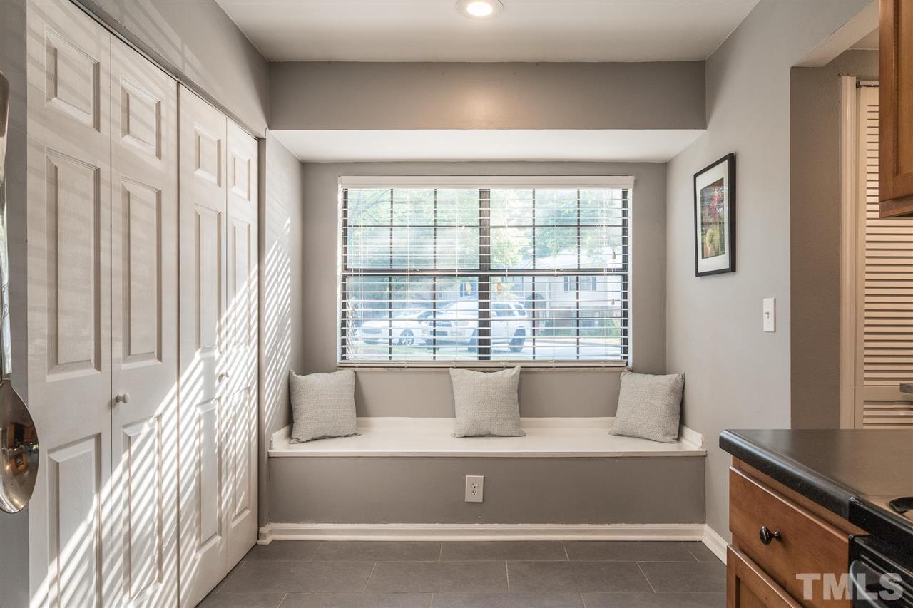 7615 Falcon Rest Circle, Unit 7615 Raleigh, NC 27615 - Photo 20 of 26 a living room with furniture and a large window