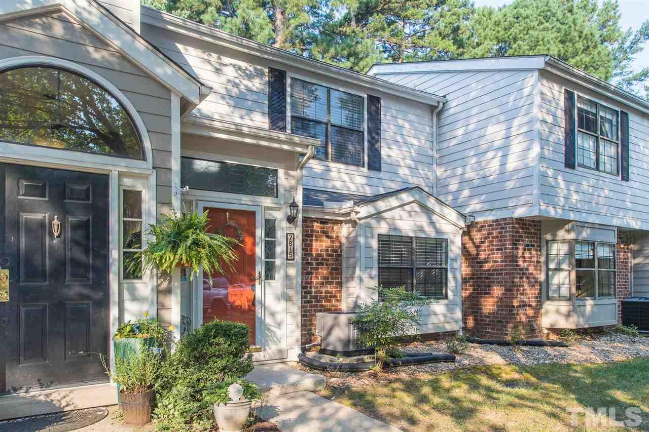 7615 Falcon Rest Circle, Unit 7615 Raleigh, NC 27615 - Photo 3 of 26 a front view of a house with garden