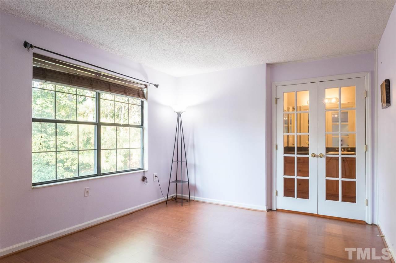 7615 Falcon Rest Circle, Unit 7615 Raleigh, NC 27615 - Photo 22 of 26 an empty room with wooden floor and windows