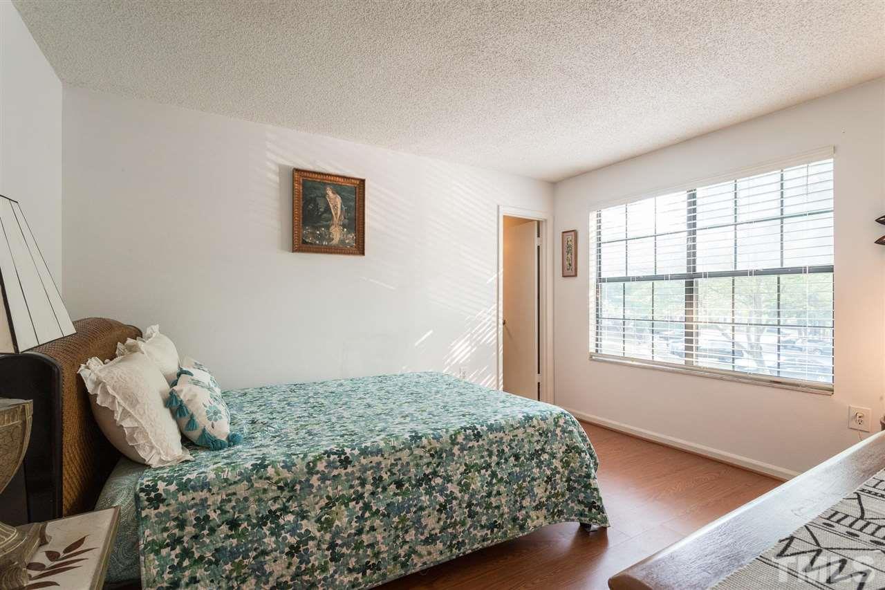 7615 Falcon Rest Circle, Unit 7615 Raleigh, NC 27615 - Photo 25 of 26 a bedroom with a bed and a window