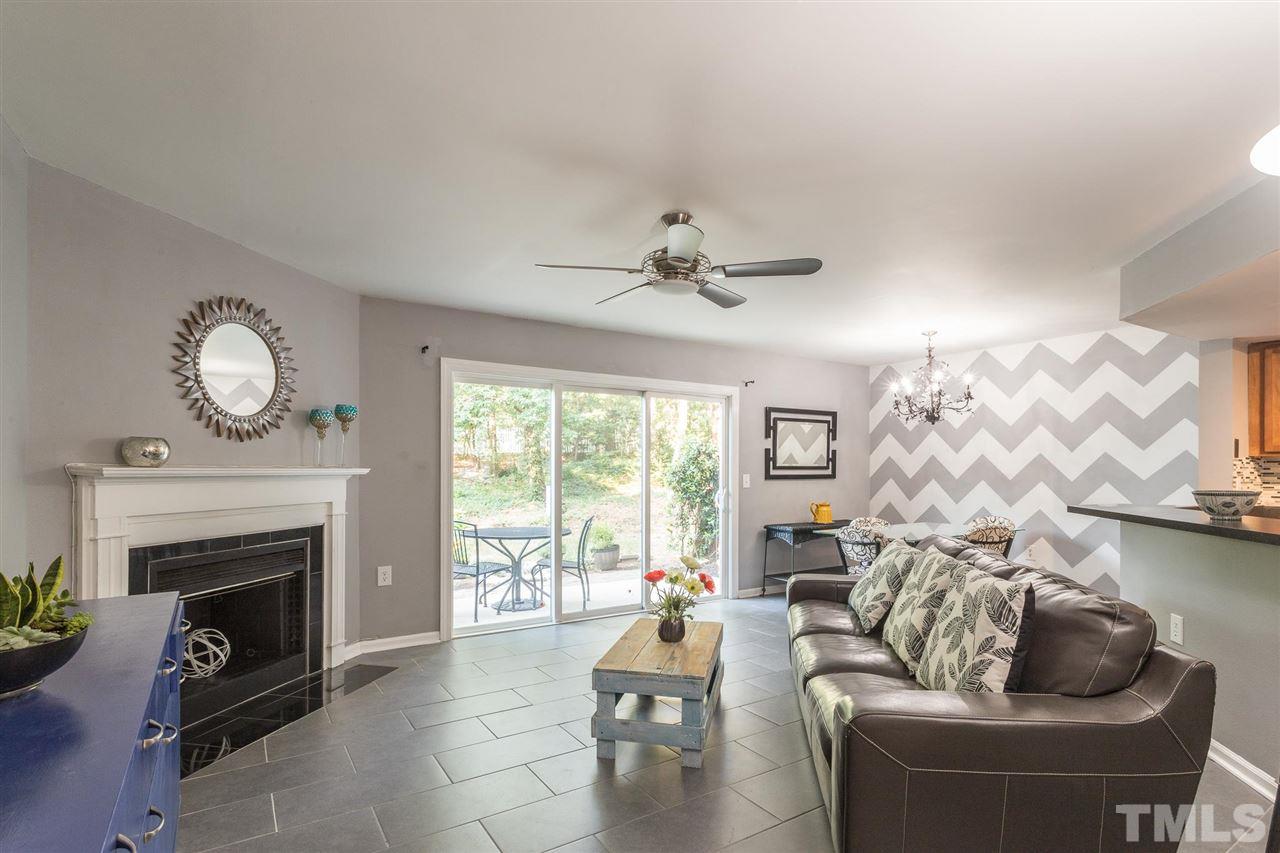 7615 Falcon Rest Circle, Unit 7615 Raleigh, NC 27615 - Photo 10 of 26 a living room with furniture and a fireplace