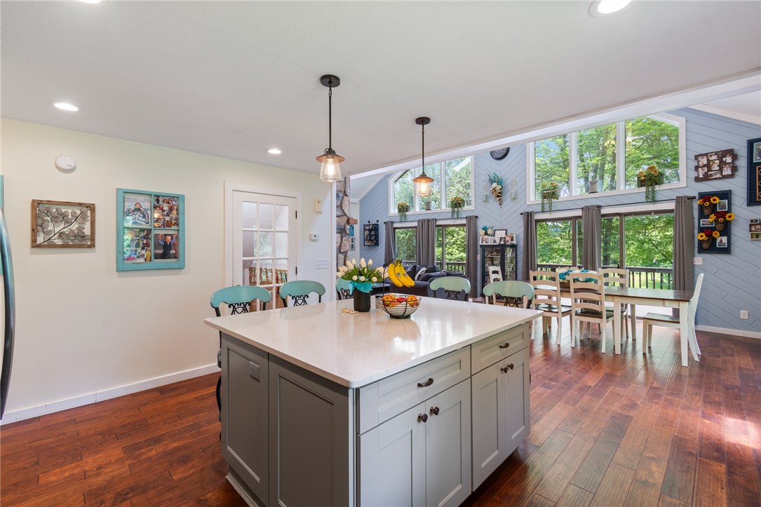7733 East Port Bay Road Wolcott, NY 14590 - Photo 21 of 49 This functional island is a great workspace in this kitchen - or just sit and visit with a friend and a coffee!