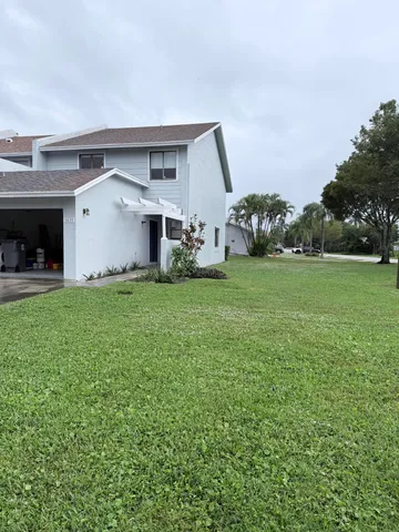 a view of balcony and yard