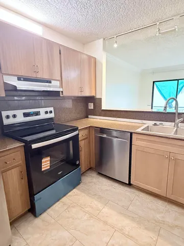 a kitchen with a stove and a sink