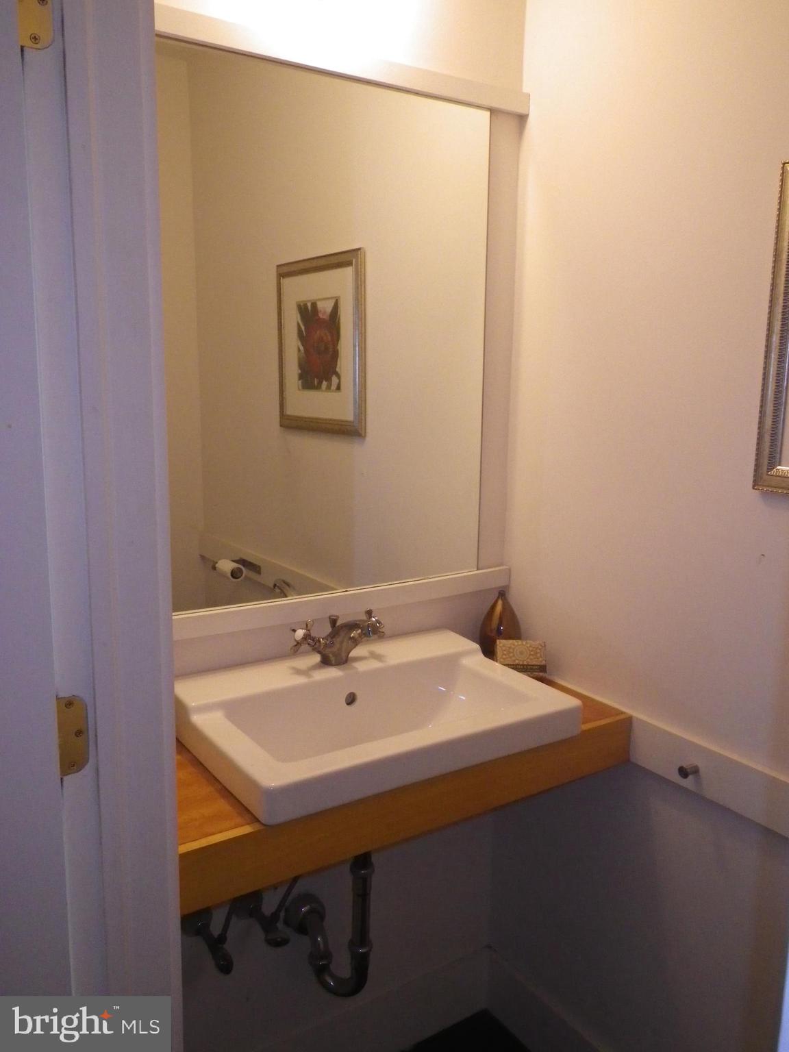 523 Budd Street Philadelphia, PA 19104 - Photo 11 of 48 a bathroom with a sink and a mirror