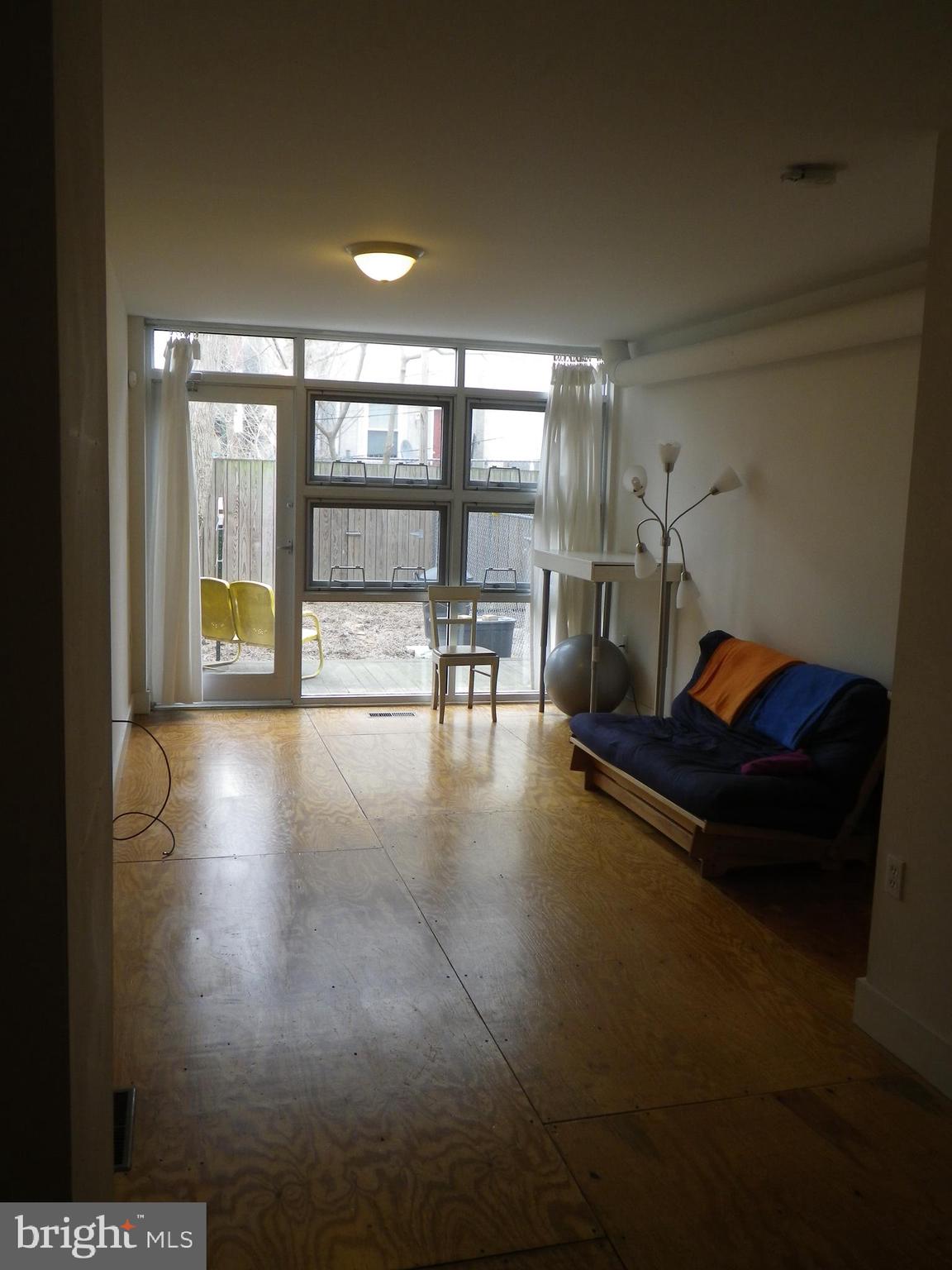 523 Budd Street Philadelphia, PA 19104 - Photo 15 of 48 a living room with furniture and a large window