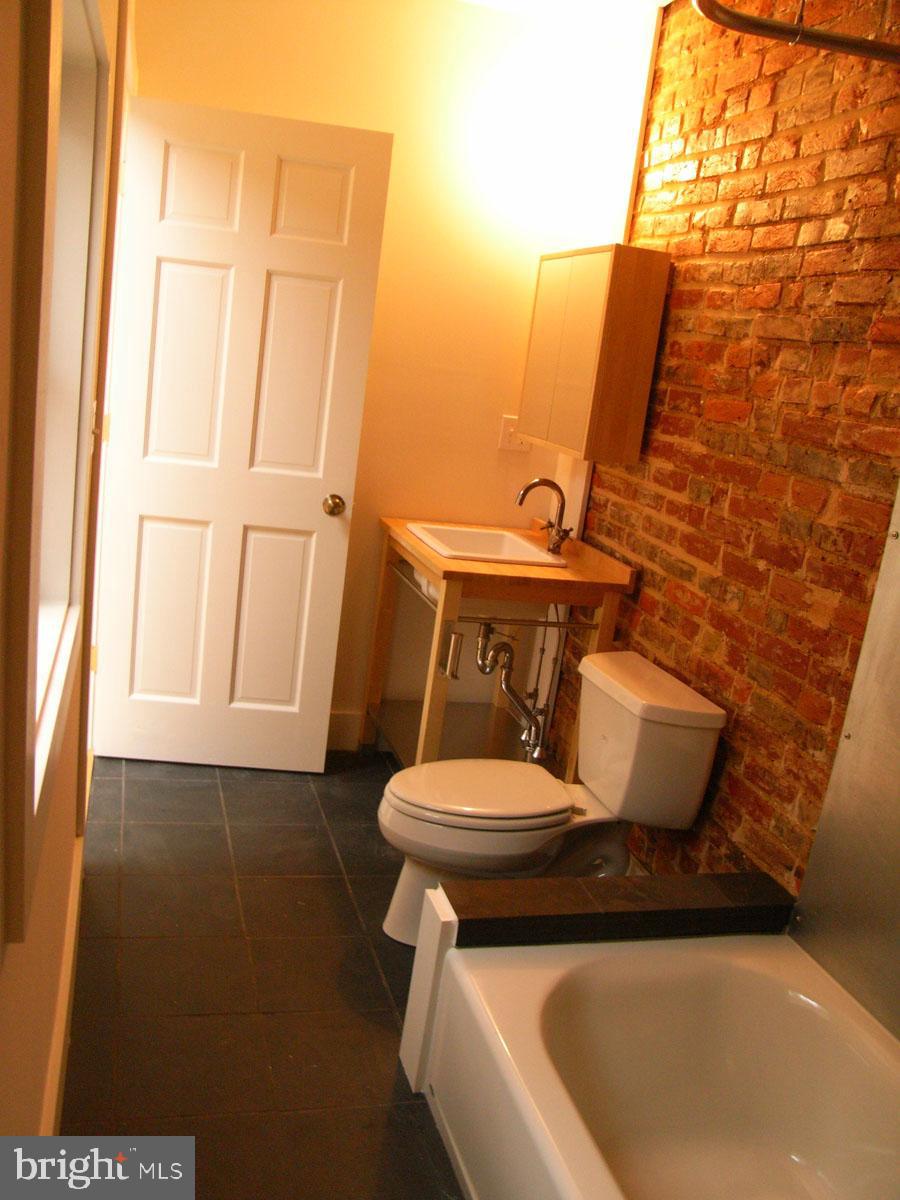 523 Budd Street Philadelphia, PA 19104 - Photo 28 of 48 a bathroom with a sink and toilet