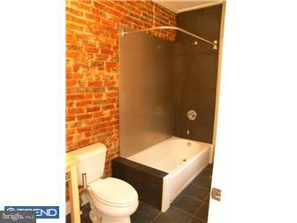 523 Budd Street Philadelphia, PA 19104 - Photo 29 of 48 a bathroom with a sink a toilet and shower